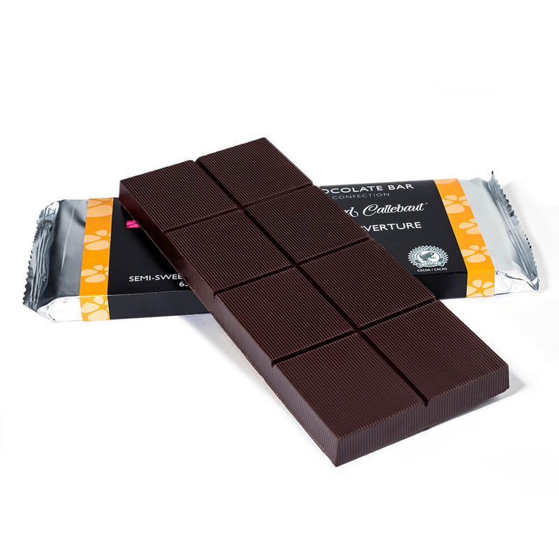 Dark chocolate baking bar propped up on to a packaged baking bar