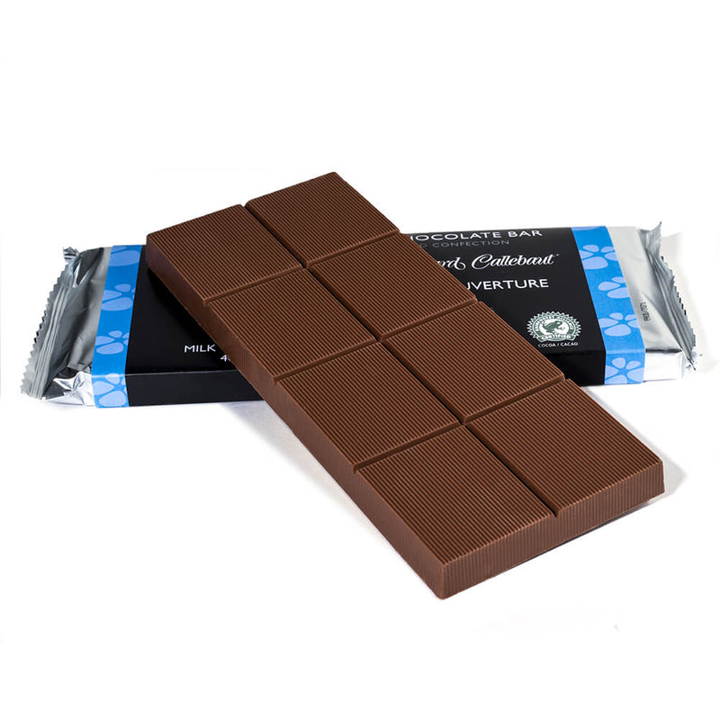 Milk chocolate baking bar propped up on to a packaged baking bar