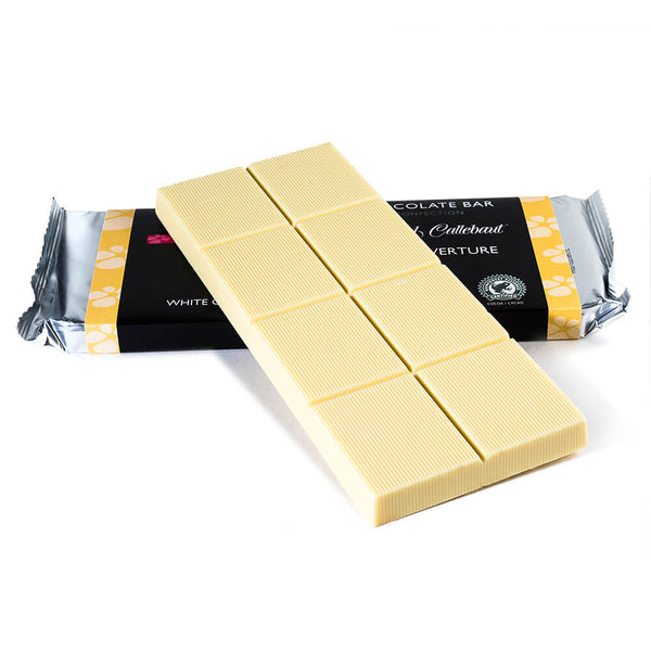 White chocolate baking bar propped up on to a packaged baking bar