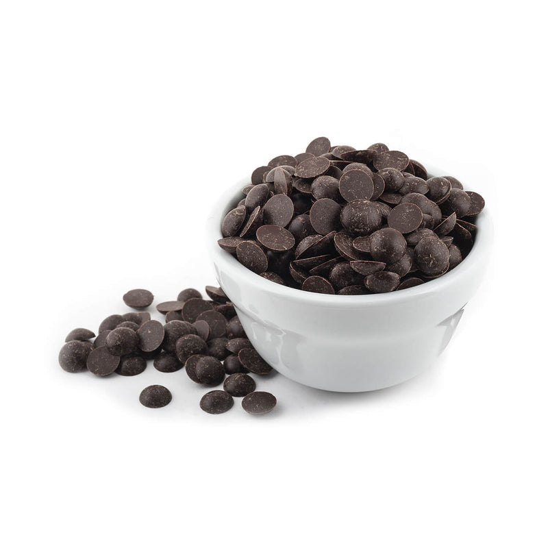 A white bowl full of semi-sweet chocolate chips