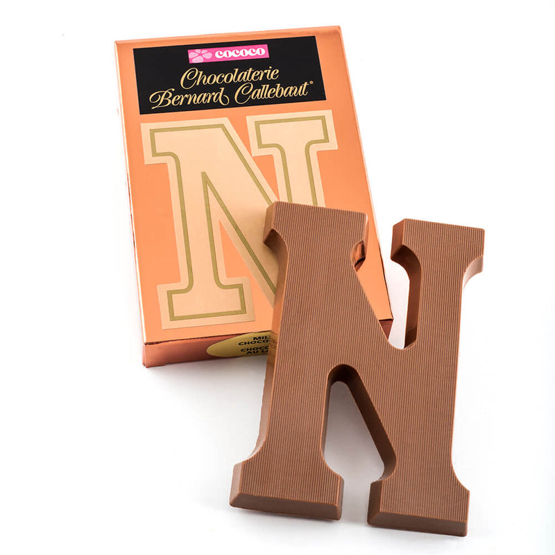 Milk chocolate letter N on top of it's Chocolaterie Bernard Callebaut®  box