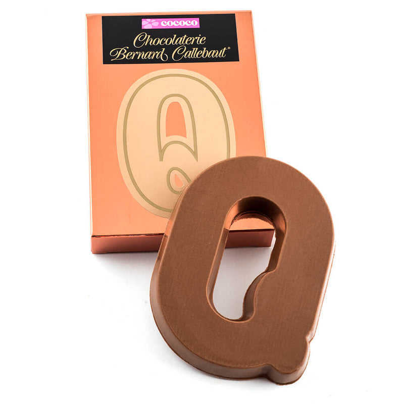 Milk chocolate letter Q on top of it's Chocolaterie Bernard Callebaut®  box