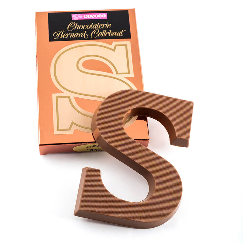 Milk chocolate letter S on top of it's Chocolaterie Bernard Callebaut®  box