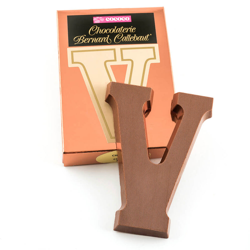 Milk chocolate letter V on top of it's Chocolaterie Bernard Callebaut®  box