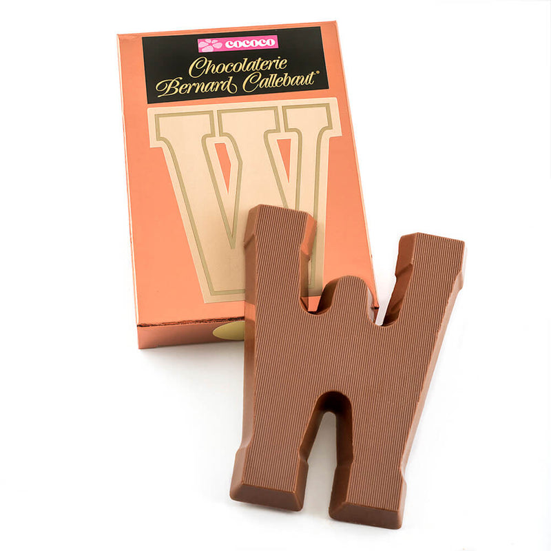 Milk chocolate letter W on top of it's Chocolaterie Bernard Callebaut®  box