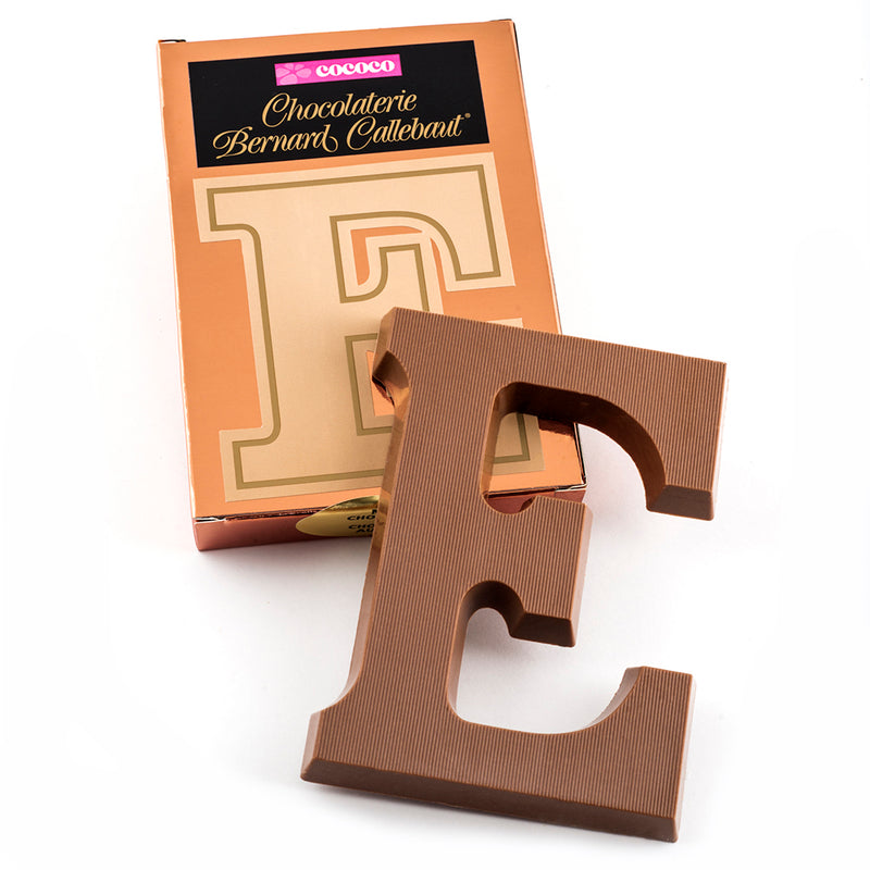 Milk chocolate letter E on top of it's Chocolaterie Bernard Callebaut®  box