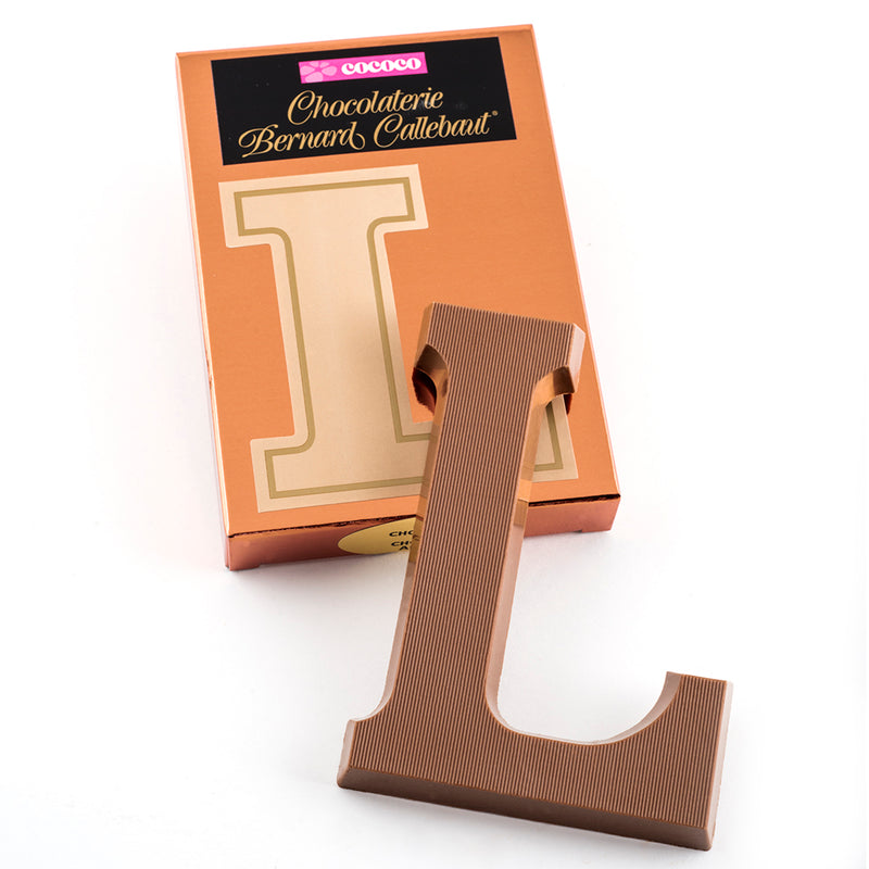 Milk chocolate letter L on top of it's Chocolaterie Bernard Callebaut®  box