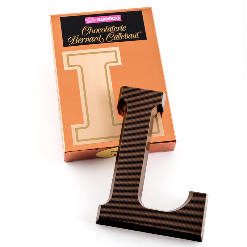 Dark chocolate letter L on top of it's Chocolaterie Bernard Callebaut®  box