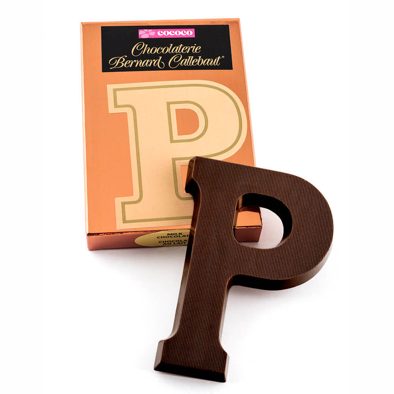 Dark chocolate letter P on top of it's Chocolaterie Bernard Callebaut®  box
