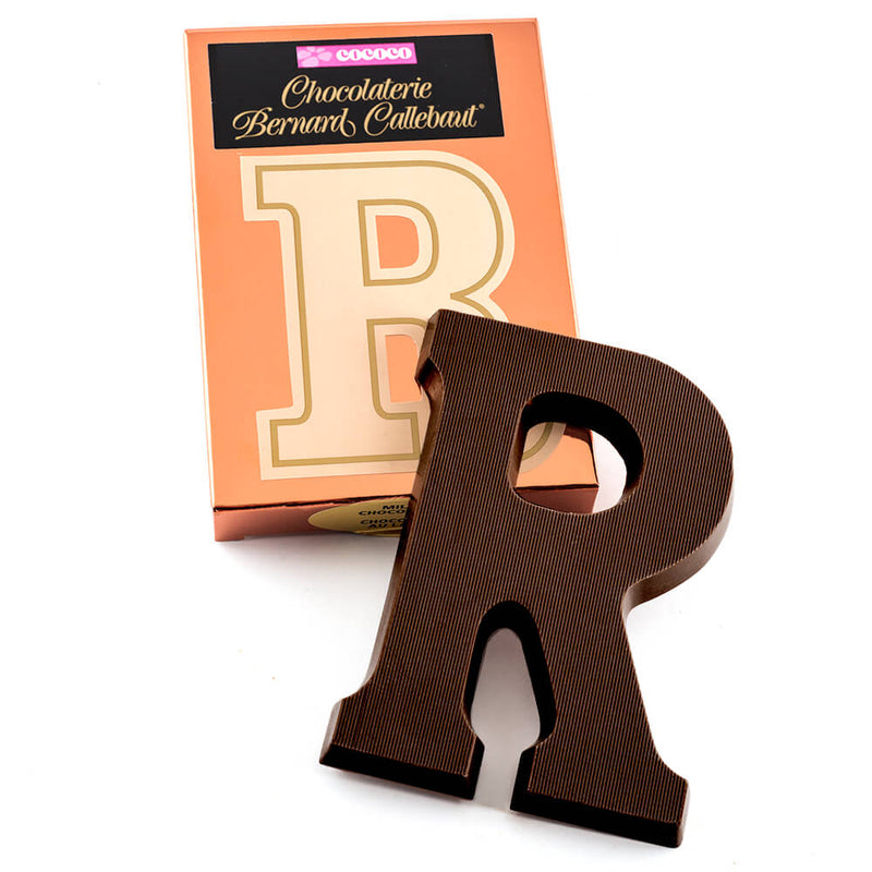 Dark chocolate letter R on top of it's Chocolaterie Bernard Callebaut®  box
