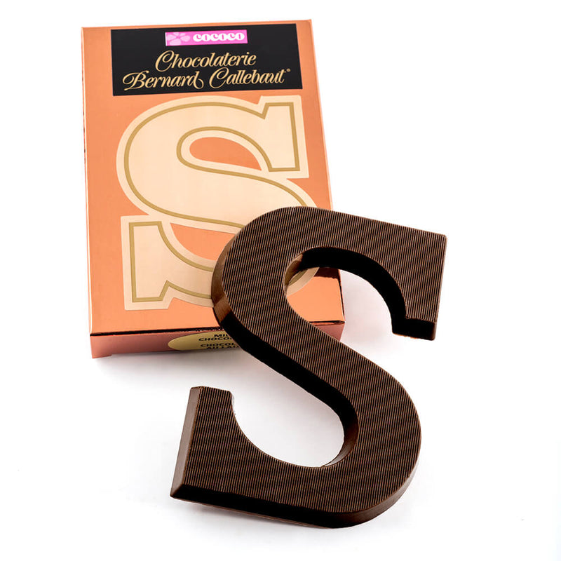 Dark chocolate letter S on top of it's Chocolaterie Bernard Callebaut®  box