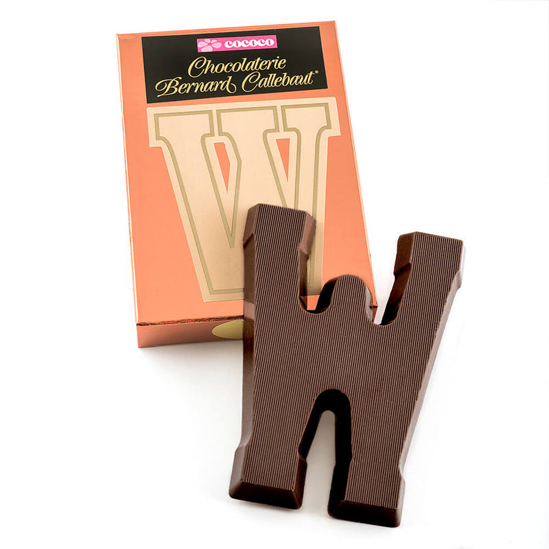 Dark chocolate letter W on top of it's Chocolaterie Bernard Callebaut®  box