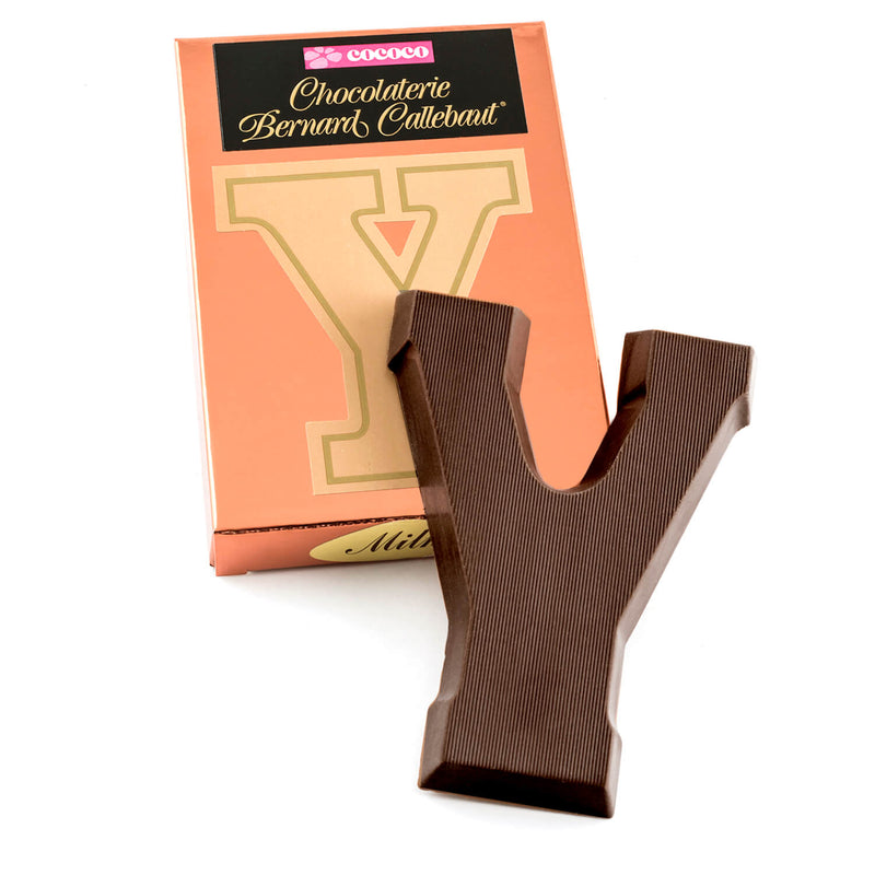 Dark chocolate letter Y on top of it's Chocolaterie Bernard Callebaut®  box
