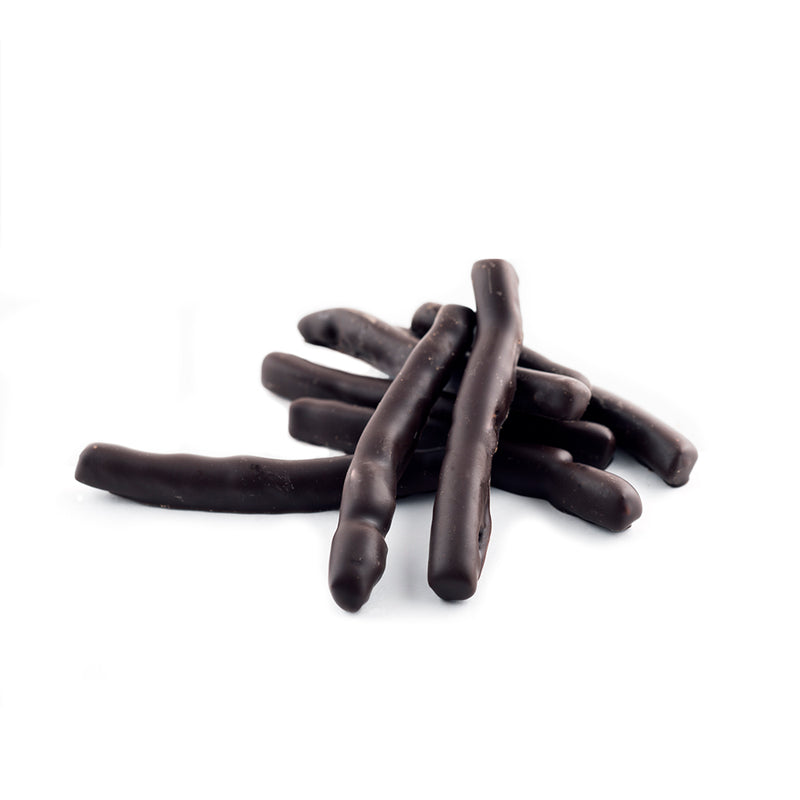 Pile of chocolate covered orange peel on a white background