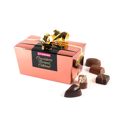 Chocolaterie Bernard Callebaut® copper chocolate box with gold ribbon and five chocolates next to box