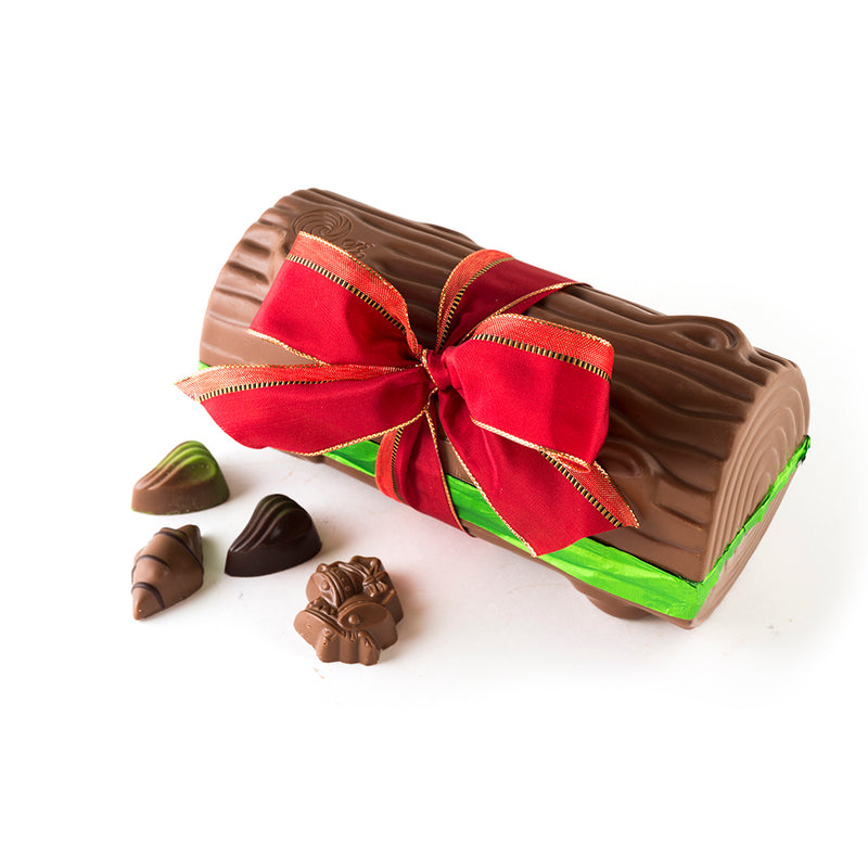 Milk Chocolate Yule Log with festive red ribbon