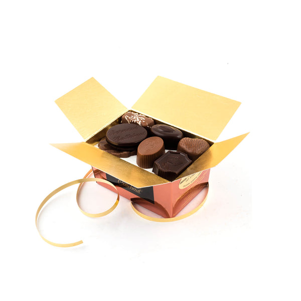 An opened Chocolaterie Bernard Callebaut® copper chocolate box